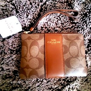 New COACH Corner Zip Wristlet In Signature Canvas signature embossed.